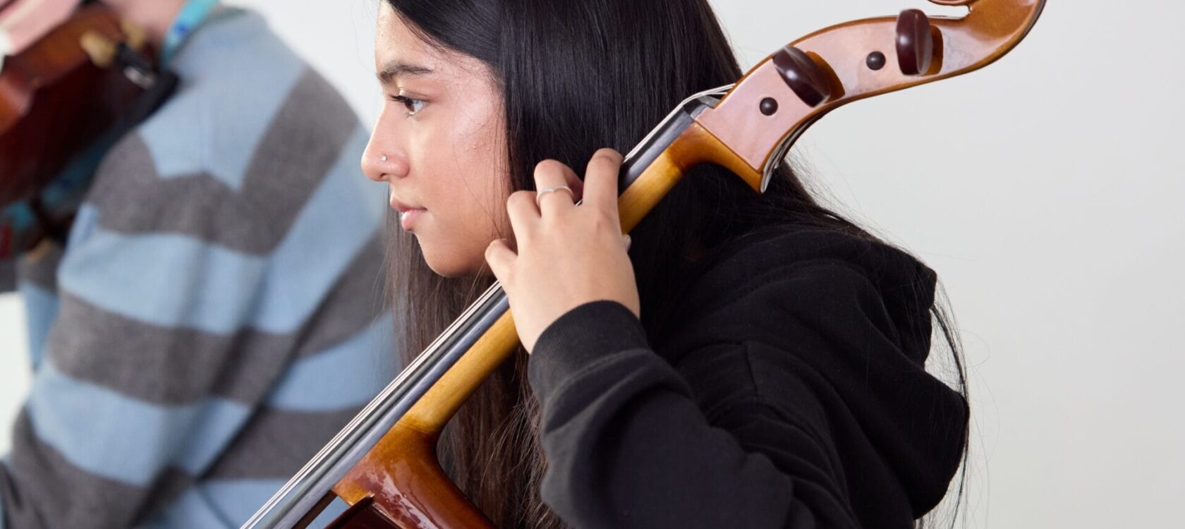 Young person playing cello