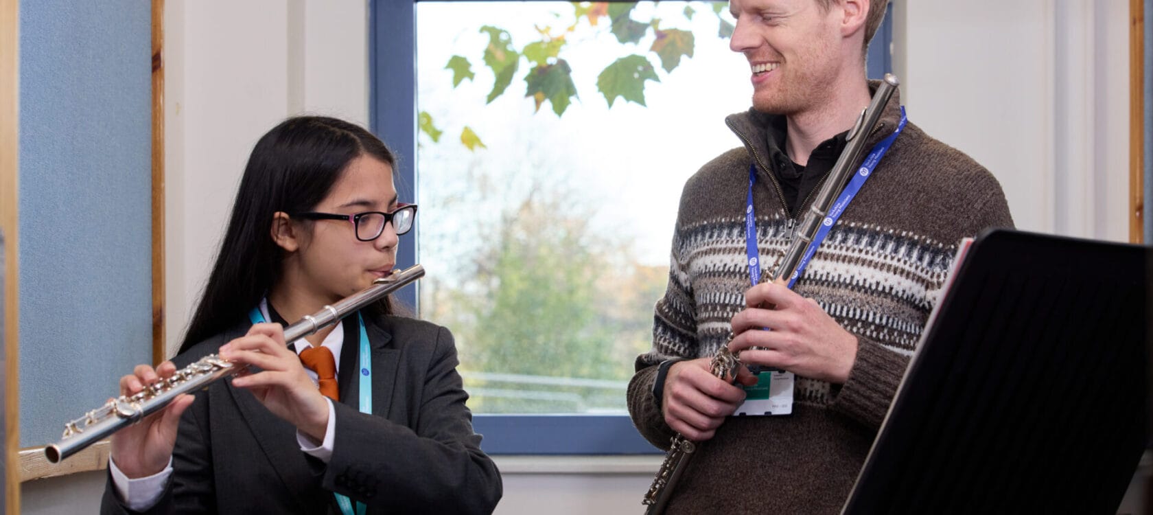 Young people playing flutes